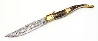 NAVAJA DE COLECCI&Oacute;N CON CACHAS DE ASTA CIERVO Y LAT&Oacute;N CURRO-ADAM